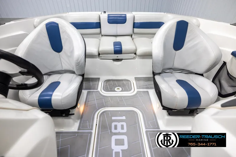 Slide: The Image of 2007 Sea-Doo 180 Challenger interior with white and blue seating, Reeder-Trausch Marine logo visible. - 17