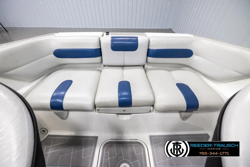 Slide: The Image of 2007 Sea-Doo 180 Challenger boat interior with white and blue seating. - 18