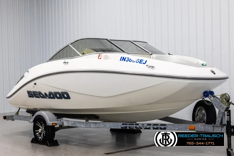 Slide: The Image of 2007 Sea-Doo 180 Challenger boat on trailer in indoor showroom. - 2