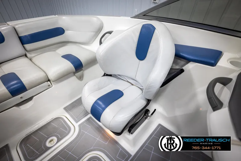 Slide: The Image of 2007 Sea-Doo 180 Challenger interior with white and blue seating. - 22