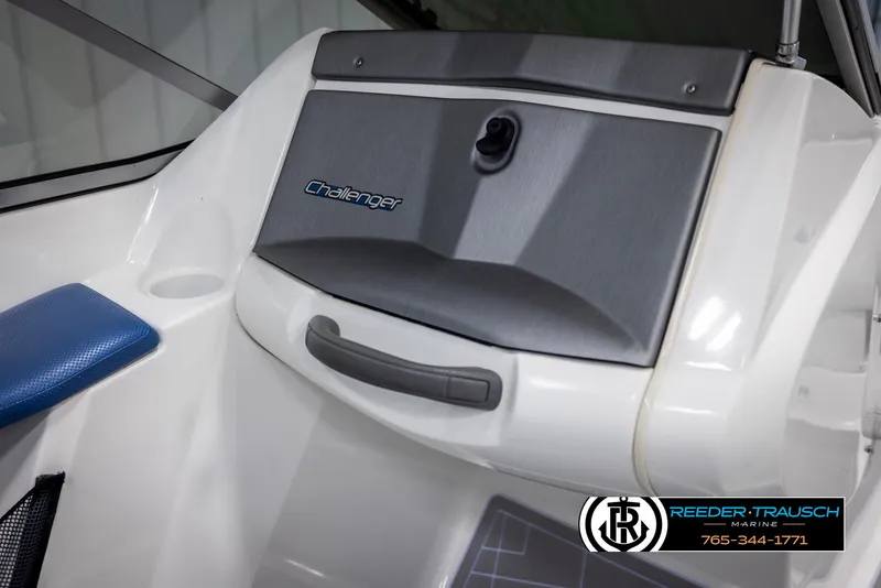 Slide: The Image of 2007 Sea-Doo 180 Challenger boat interior with storage compartment and branding. - 23
