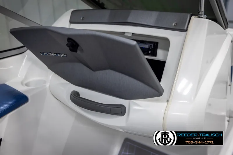 Slide: The Image of 2007 Sea-Doo 180 Challenger boat dashboard with open storage compartment. - 24