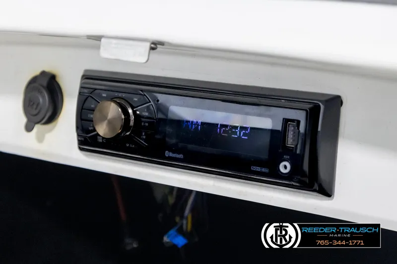 Slide: The Image of 2007 Sea-Doo 180 Challenger dashboard with modern stereo system and USB port. - 25