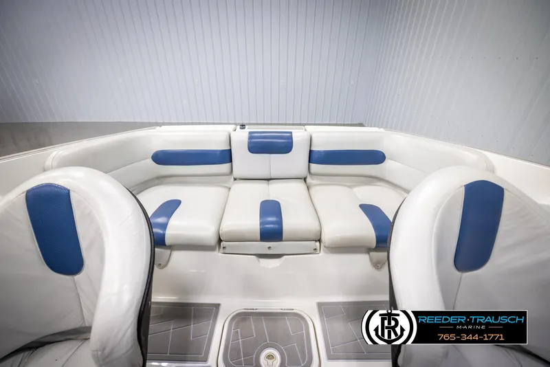 Slide: The Image of 2007 Sea-Doo 180 Challenger boat interior with blue and white seating. - 26