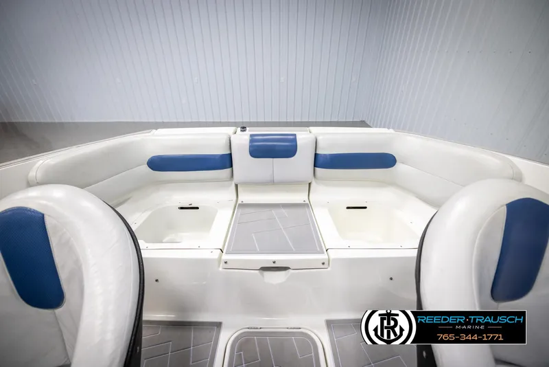 Slide: The Image of 2007 Sea-Doo 180 Challenger boat interior with blue and white seating. - 27