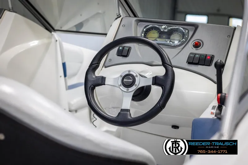 Slide: The Image of 2007 Sea-Doo 180 Challenger dashboard with steering wheel and controls. - 29