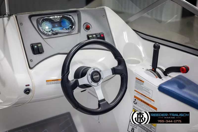 Slide: The Image of 2007 Sea-Doo 180 Challenger boat dashboard with steering wheel and control panel. - 30