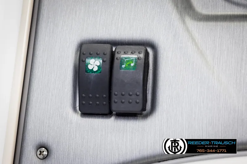 Slide: The Image of Dashboard switches on a 2007 Sea-Doo 180 Challenger boat. - 32