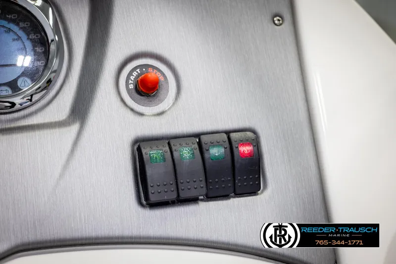 Slide: The Image of Dashboard controls of a 2007 Sea-Doo 180 Challenger boat with start button and switches. - 35