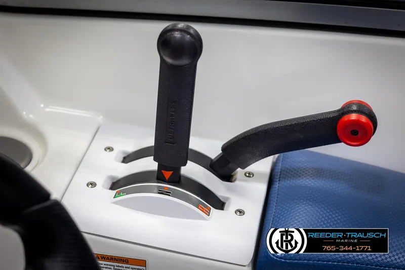 Slide: The Image of 2007 Sea-Doo 180 Challenger throttle controls with Reeder-Trausch Marine branding. - 36