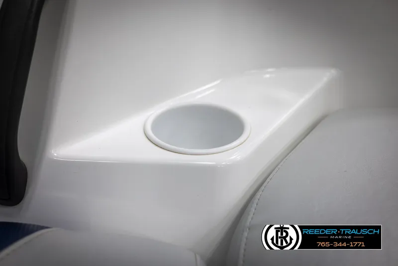 Slide: The Image of 2007 Sea-Doo 180 Challenger cup holder detail with Reeder-Trausch Marine logo. - 41
