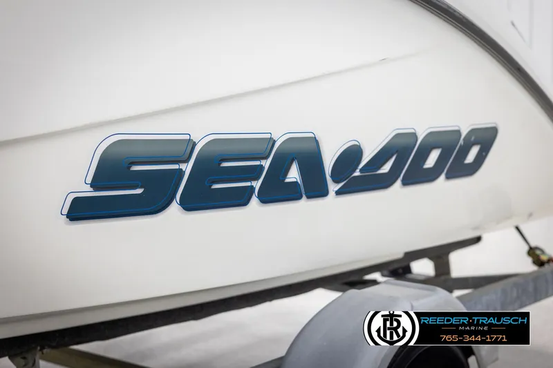 Slide: The Image of 2007 Sea-Doo 180 Challenger boat logo on white hull, Reeder-Trausch Marine branding visible. - 49