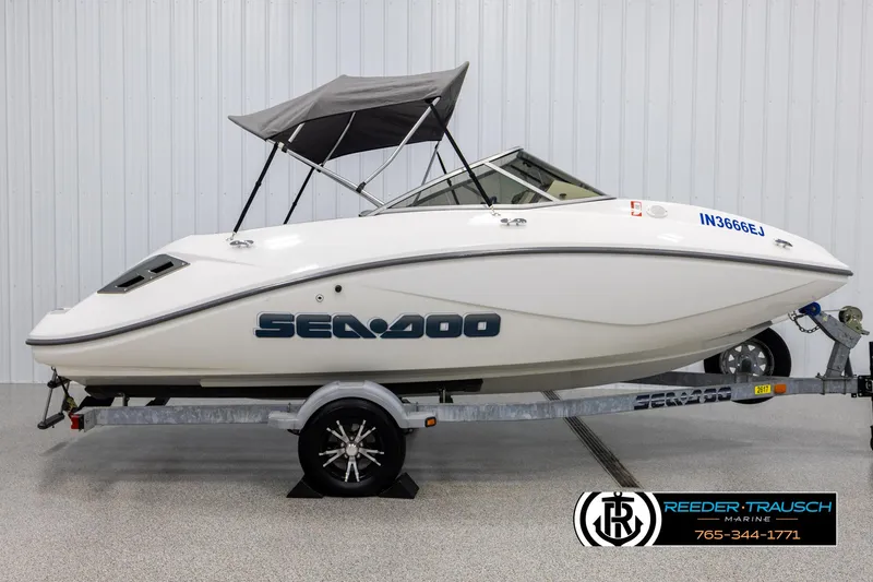Slide: The Image of 2007 Sea-Doo 180 Challenger boat on trailer with canopy in showroom. - 5