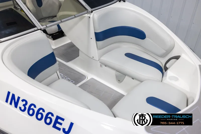 Slide: The Image of 2007 Sea-Doo 180 Challenger boat interior with white and blue seating. - 9
