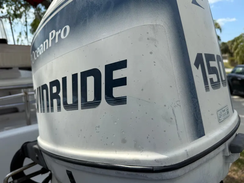Slide: The Image of Close-up of Evinrude 150 outboard motor on 1996 Boston Whaler Outrage 17 boat. - 14