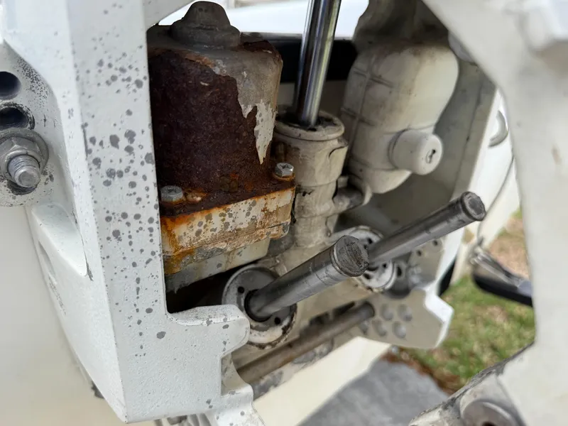 Slide: The Image of Close-up of a rusty engine component on a 1996 Boston Whaler Outrage 17 boat. - 15