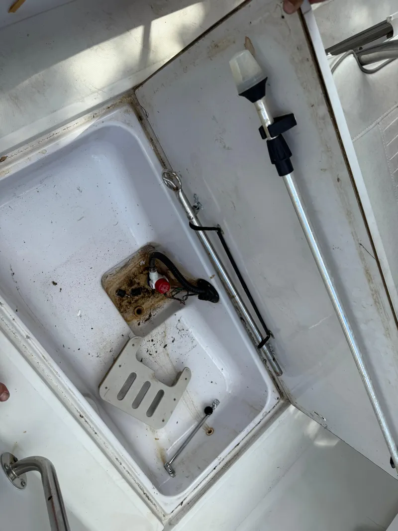 Slide: The Image of Open storage compartment in a 1996 Boston Whaler Outrage 17 boat. - 24