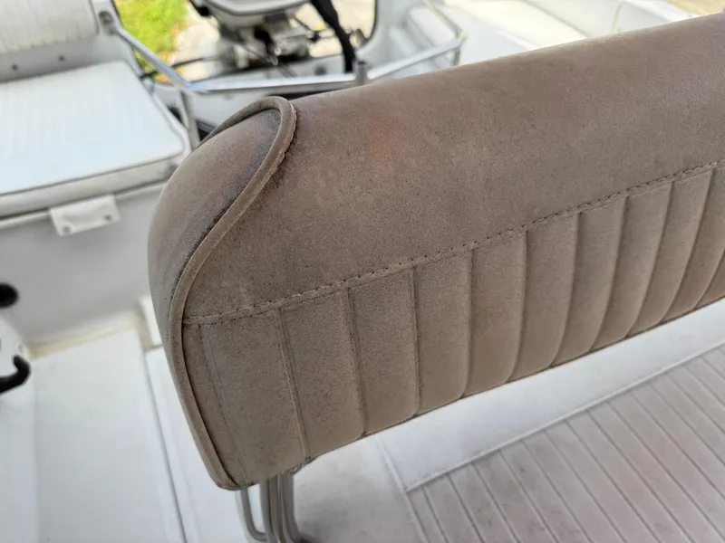 Slide: The Image of 1996 Boston Whaler Outrage 17 boat seat detail, showcasing upholstery and design. - 28
