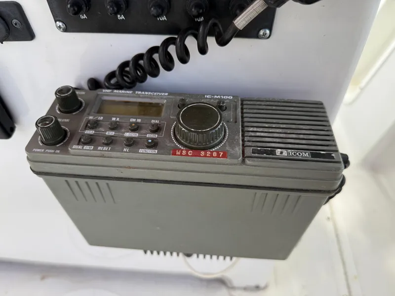 Slide: The Image of ICOM marine transceiver IC-M120 on a 1996 Boston Whaler Outrage 17 boat. - 34