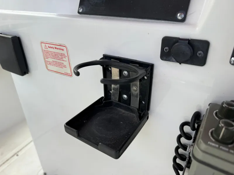 Slide: The Image of Cup holder on a 1996 Boston Whaler Outrage 17 boat console. - 38