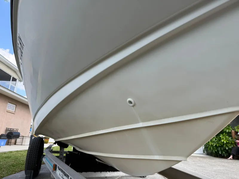 Slide: The Image of 1996 Boston Whaler Outrage 17 boat hull on trailer, close-up view. - 4
