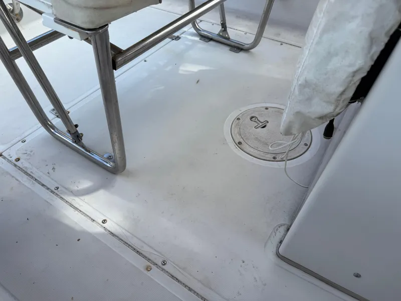 Slide: The Image of 1996 Boston Whaler Outrage 17 boat interior, featuring seating and deck details. - 46