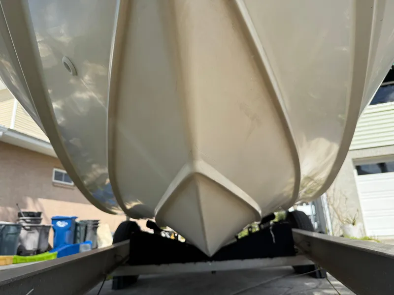Slide: The Image of 1996 Boston Whaler Outrage 17 boat hull on trailer, viewed from below. - 5