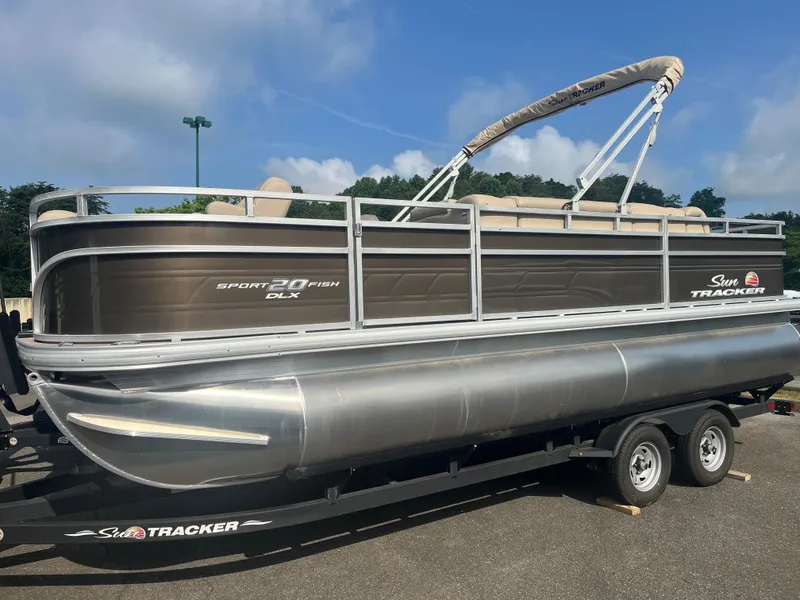 The Image of 2025 Sun Tracker SportFish 20 DLX pontoon boat with canopy, side view. - 0