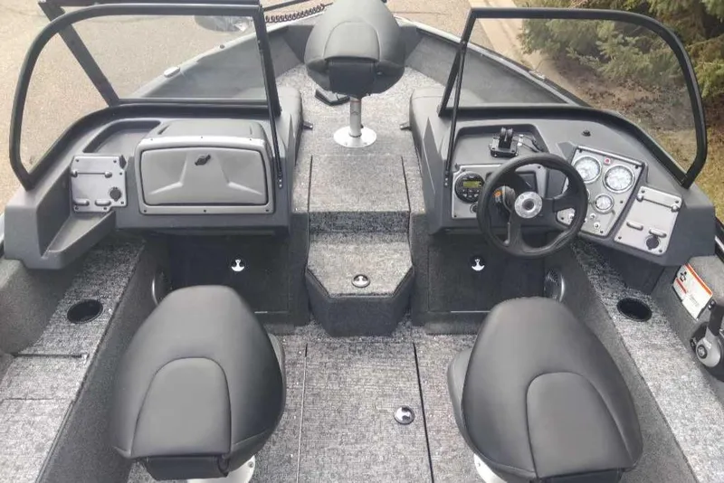 Slide: The Image of 2025 Tracker Pro Guide V-175 Combo boat interior with dual seats and control panel. - 3