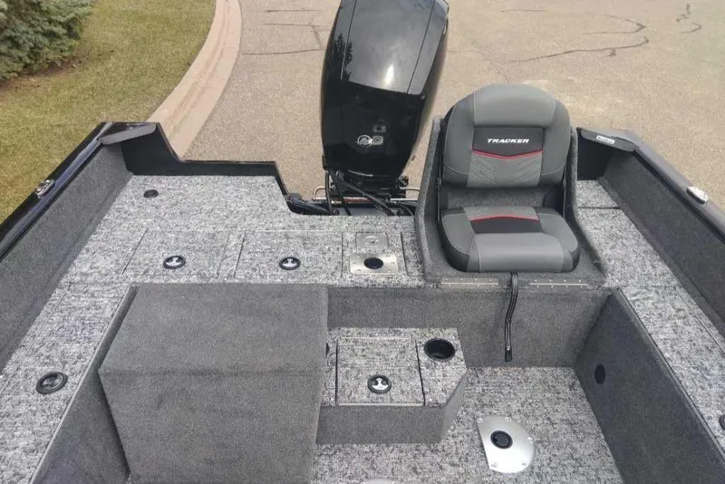 Slide: The Image of 2025 Tracker Pro Guide V-175 Combo boat interior with seating and storage compartments. - 4