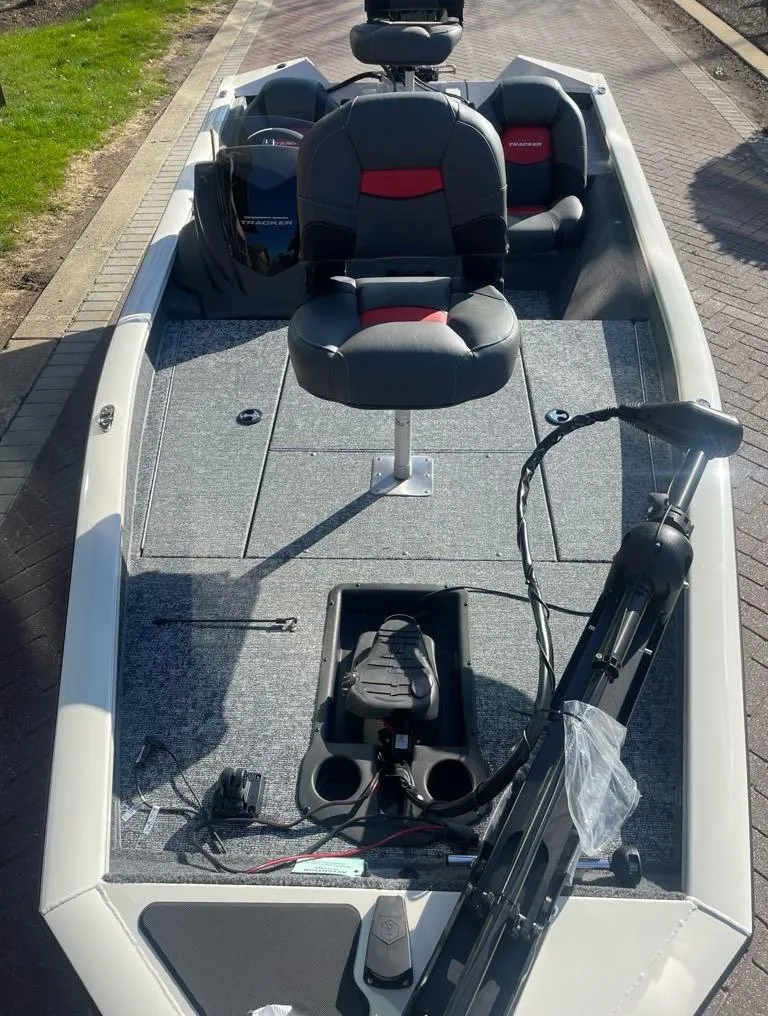 Slide: The Image of 2025 Tracker Pro Team 175 boat with seating and fishing equipment on deck. - 3