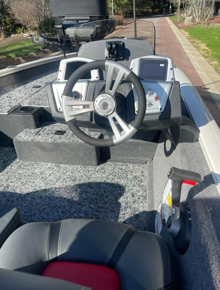 Slide: The Image of 2025 Tracker Pro Team 175 boat interior with steering wheel and control panel. - 5