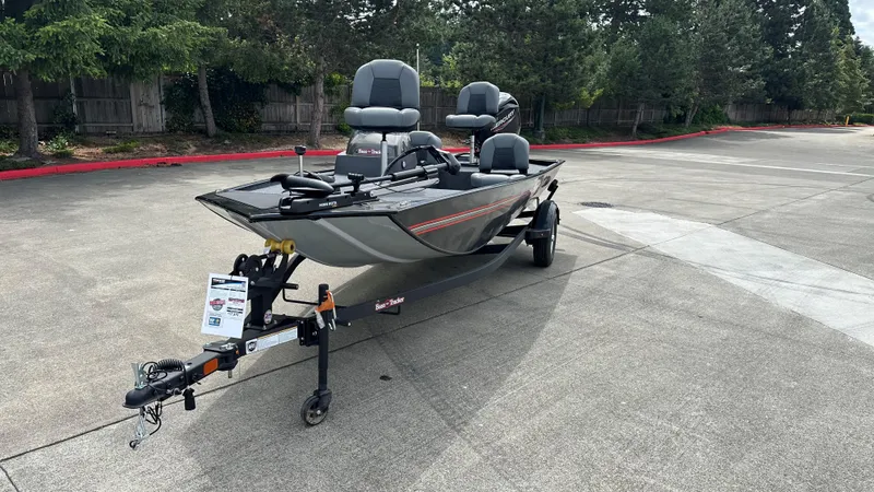 Slide: The Image of 2025 Tracker Bass Tracker Classic XL boat on trailer in parking lot. - 14