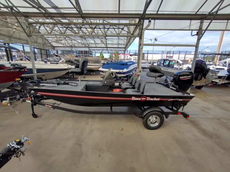 Slide: The Image of 2025 Tracker Bass Tracker Classic XL boat in showroom, side view. - 3
