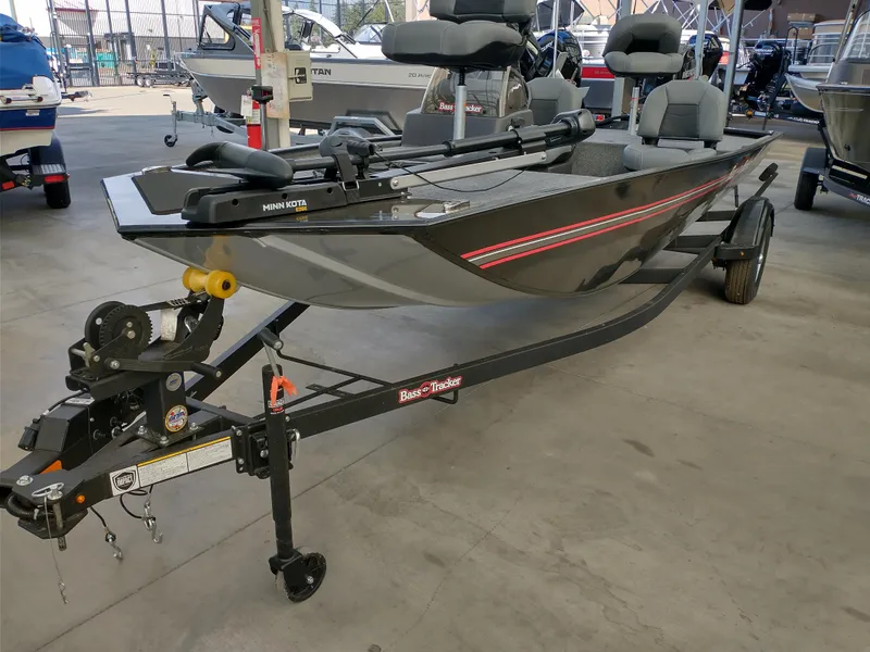 Slide: The Image of 2025 Tracker Bass Tracker Classic XL boat on trailer in showroom. - 5