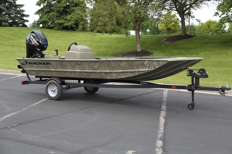 The Image of 2025 Tracker Grizzly 1648 SC boat on trailer in parking lot. - 0