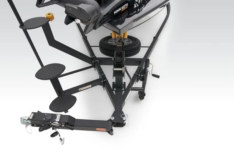 Slide: The Image of 2025 Tracker Targa V-19 WT boat interior with steering wheel and storage compartments. - 11