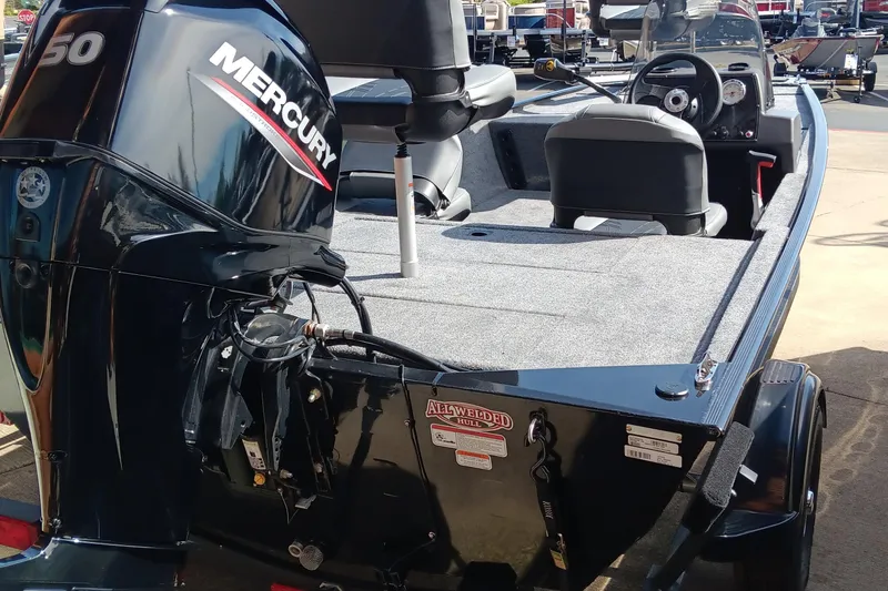 Slide: The Image of 2025 Tracker Bass Tracker Classic XL boat with Mercury engine, rear view. - 3