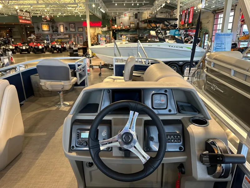 Slide: The Image of Interior view of 2025 Sun Tracker Fishin' Barge 20 DLX at a showroom. - 3