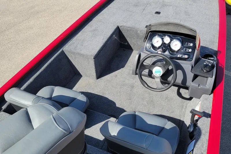 Slide: The Image of 2025 Tracker Pro 170 boat interior with steering console and gray seating. - 3
