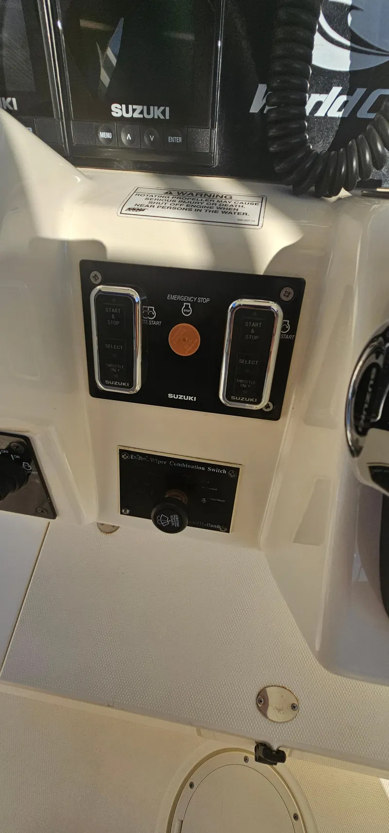 Slide: The Image of Control panel of a 2016 World Cat 320 boat with Suzuki equipment. - 16