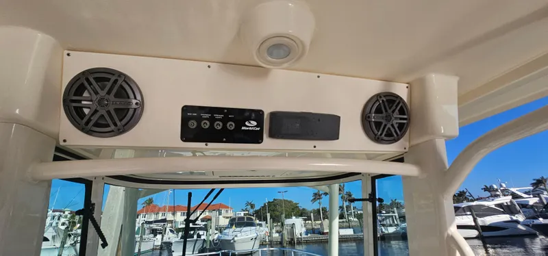 Slide: The Image of 2016 World Cat 320 boat interior with audio system and marina view. - 17