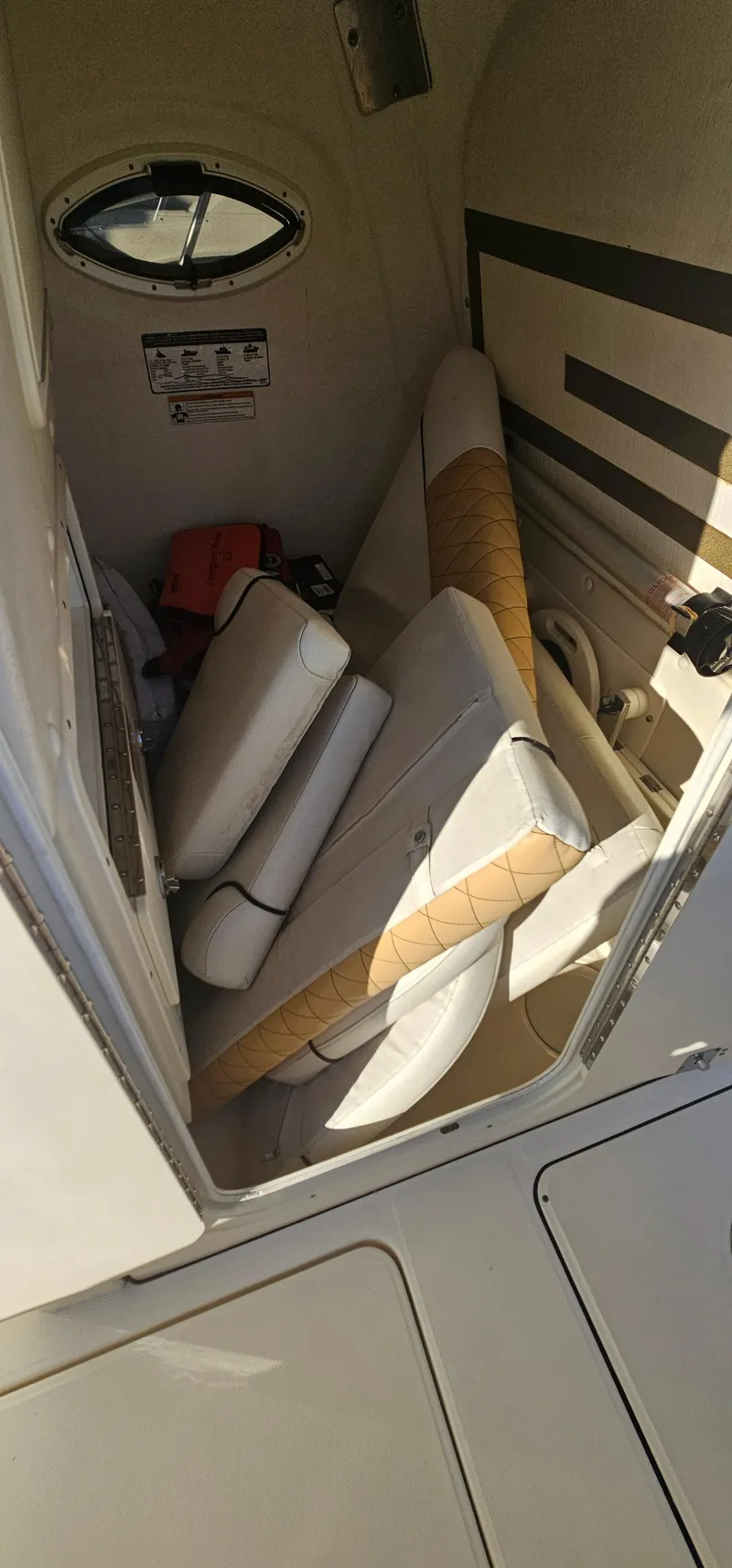 Slide: The Image of Interior cabin of 2016 World Cat 320 boat with cushioned seating. - 18