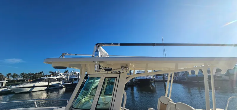 Slide: The Image of 2016 World Cat 320 boat docked under clear blue sky. - 3