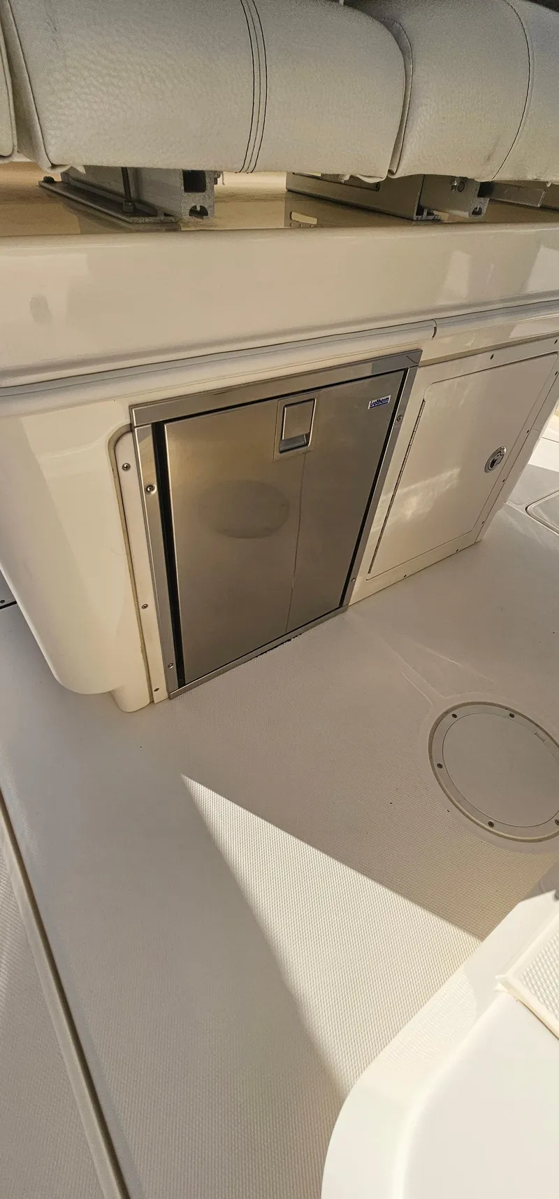 Slide: The Image of 2016 World Cat 320 boat interior with stainless steel storage compartment. - 35