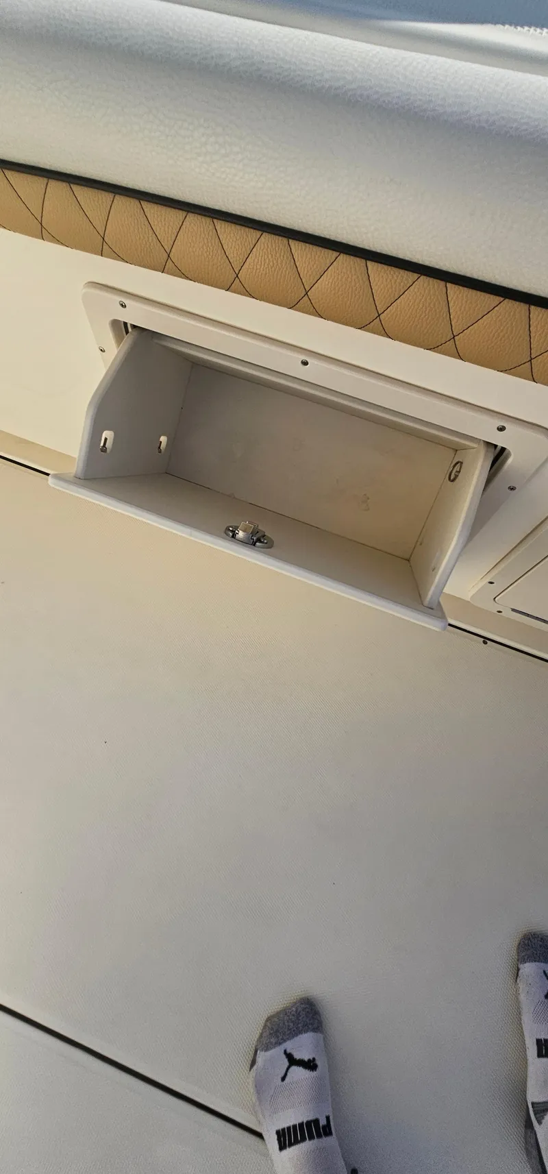 Slide: The Image of Open storage compartment on a 2016 World Cat 320 boat deck. - 39