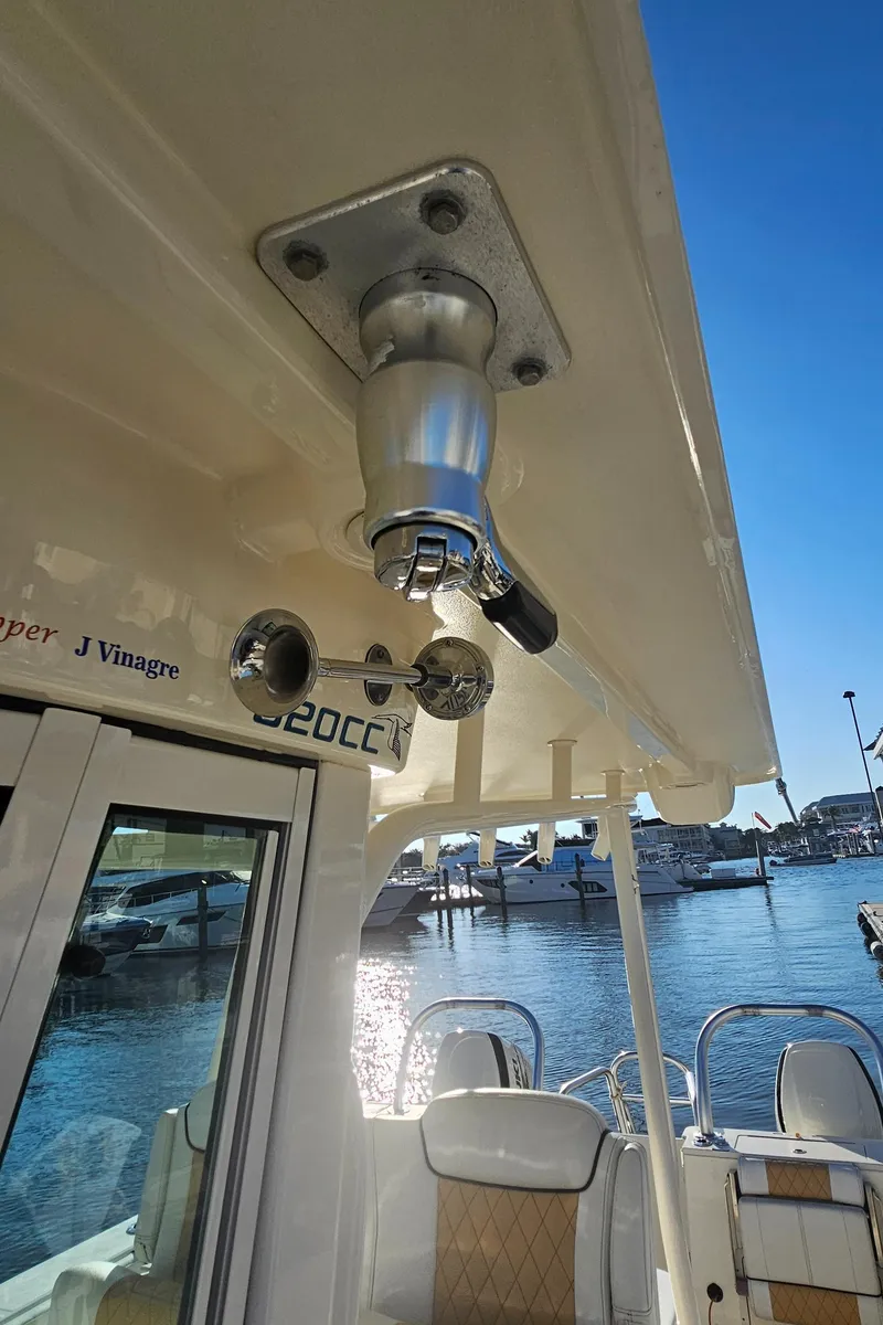 Slide: The Image of 2016 World Cat 320 boat interior with mounted equipment, docked at marina. - 4