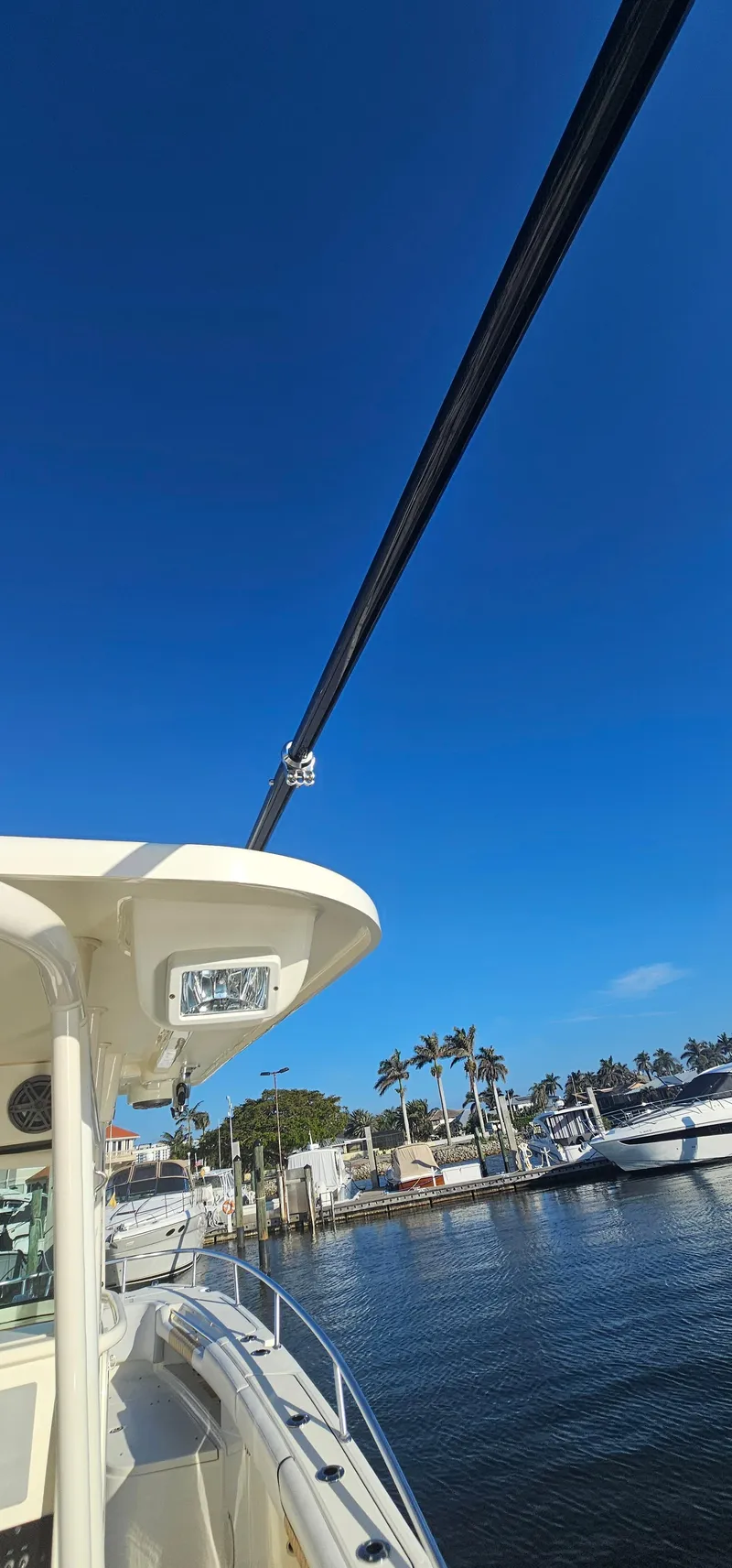 Slide: The Image of 2016 World Cat 320 boat docked under clear blue sky. - 6