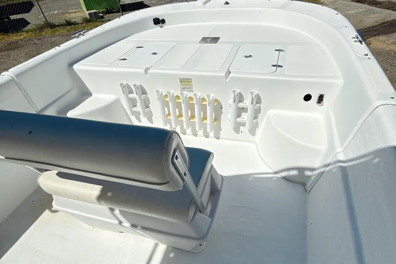 Slide: The Image of 2008 Carolina Skiff 238 DLV boat interior with seating and storage compartments. - 10