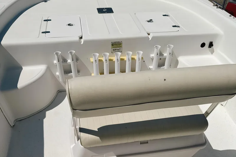 Slide: The Image of 2008 Carolina Skiff 238 DLV boat interior with rod holders and seating. - 15